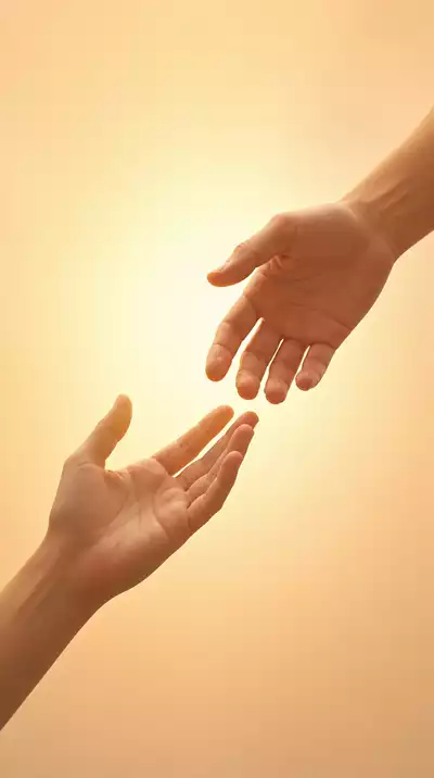 Hands reaching out in a gesture of reconciliation and forgiveness